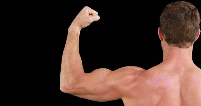 Muscular Man Flexing Arm displaying Strength and Fitness against Black Background - Download Free Stock Images Pikwizard.com