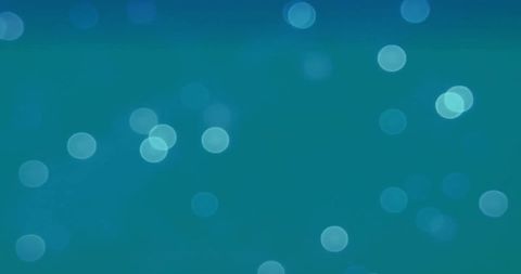 Abstract glowing light spots on blue background