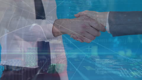 Entrepreneurs Shaking Hands Over Business Data and Graphs