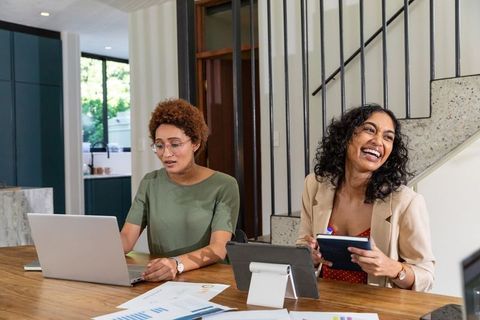 Diverse Coworkers Collaborating in Modern Home Office Workspace