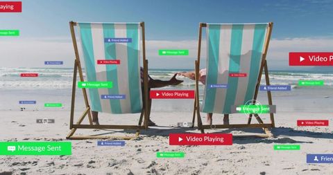 Couple relaxing on beach chairs receiving social media notifications and video alerts