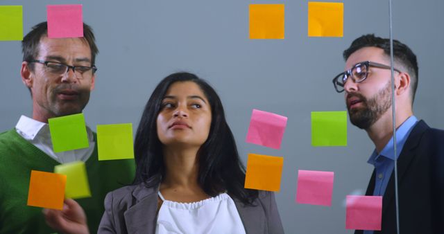 Diverse Team Collaborating with Colorful Sticky Notes - Download Free Stock Images Pikwizard.com