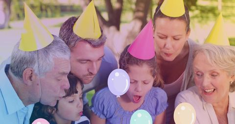 Multigenerational Family Celebrating Birthday with Balloon Decorations
