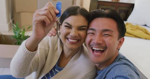 Diverse Couple Celebrating New Home with Keys - Download Free Stock Images Pikwizard.com