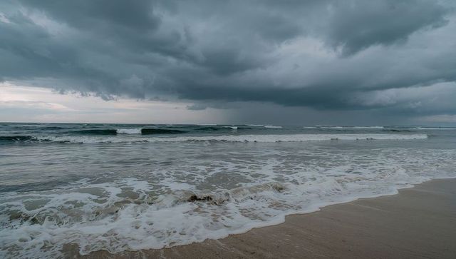 Thunderous Ocean Waves Crashing Against Scenic Shoreline