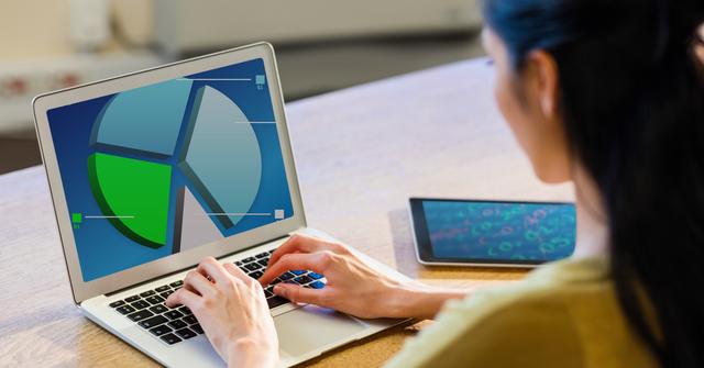 Woman Analyzing Data on Laptop with Digital Pie Chart Display - Download Free Stock Photos Pikwizard.com