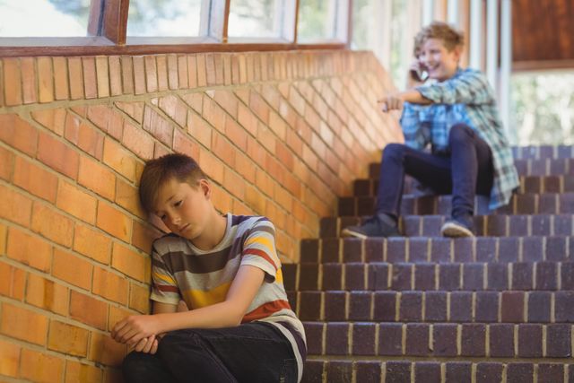 Sad Boy Being Bullied in School Corridor - Download Free Stock Photos Pikwizard.com