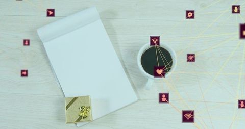 Minimal desk flatlay blank notepad, coffee cup, gift box and digital network connection