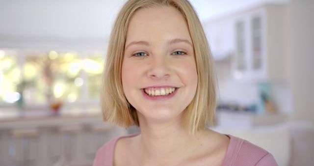 Smiling Young Woman in Modern Bright Kitchen - Download Free Stock Images Pikwizard.com