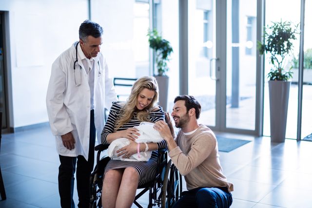 Couple looking at their newborn baby in the hospital