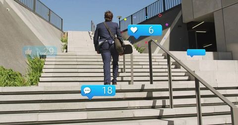Executive climbing concrete stairs carrying shoulder bag with social media notifications