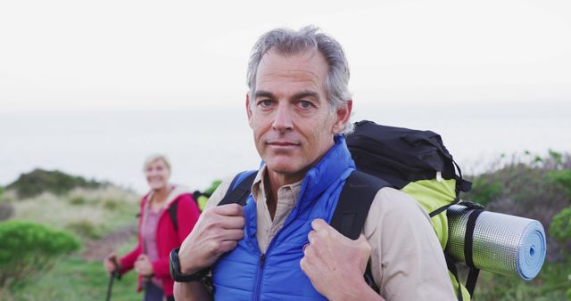 Mature Hikers Enjoying Outdoor Adventure on Coastal Trail - Download Free Stock Images Pikwizard.com