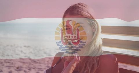 Woman Relaxing on Beach with Flag Overlay Under Clear Skies