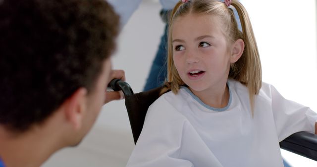 Doctor Talking to Young Girl in Wheelchair at Hospital - Download Free Stock Images Pikwizard.com