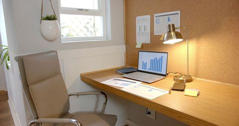 Minimalist home office workspace with wooden floating desk