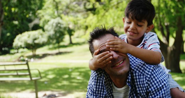 Father and Son Playing in Park with Green Trees - Download Free Stock Images Pikwizard.com