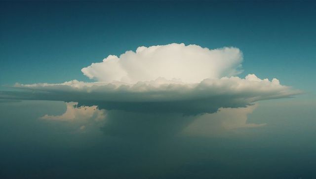 Towering anvil-shaped cumulonimbus at high altitude