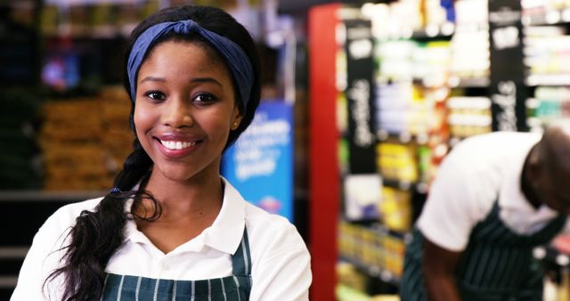 Smiling Supermarket Employee in Uniform Serving Customers - Download Free Stock Images Pikwizard.com