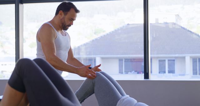 Personal Trainer Assisting Client in Office Workout Session - Download Free Stock Images Pikwizard.com