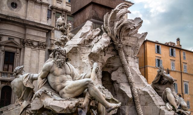 Baroque fountain designed by Gian Lorenzo Bernini in Piazza Navona, Rome. Depicts river gods. Suitable for tourism promotions, travel blogs, historical documentaries, and art publications.