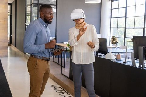 Modern Coworkers Using Virtual Reality in a Contemporary Office