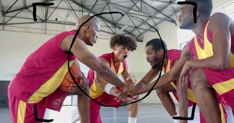 Stacking hands calling play basketball team huddle wearing magenta yellow jerseys