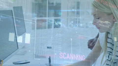 Diverse Colleagues Analyzing Data on Computers in Modern Office