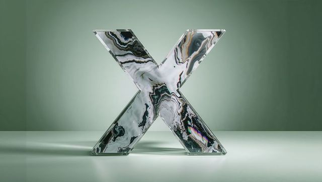 Glossy marble-patterned x against green gradients