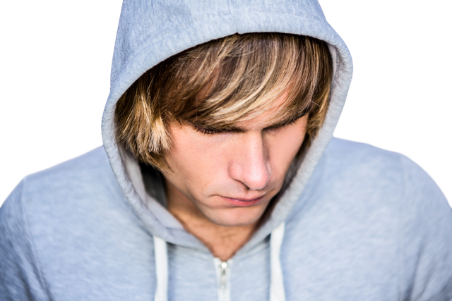 Focused Man in Hoodie With Downcast Eyes Looking Serious Transparent Background - Download Free Stock Videos Pikwizard.com