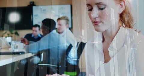 Female Executive Analyzing Financial Data on Digital Tablet