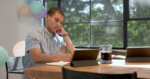Multiracial Business Professional Working in Decorated Office