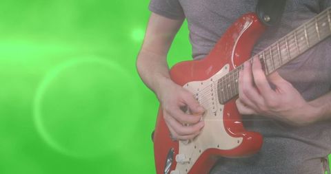 Man Playing Electric Guitar on Green Screen Background