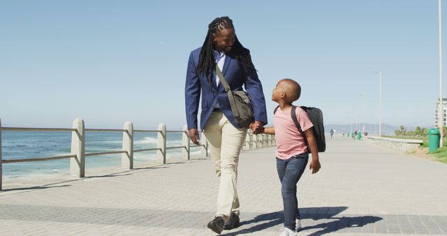 Happy African American Father and Son Walking Along Beachfront - Download Free Stock Images Pikwizard.com