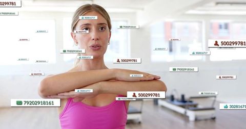 Woman doing pilates with digital data overlay showing fitness tracking and social metrics