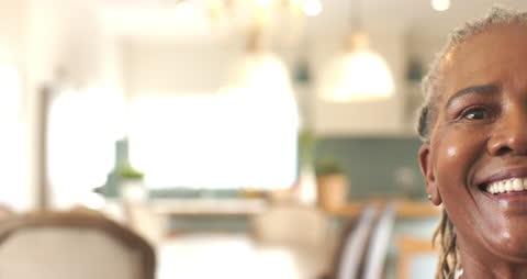 Joyful Senior Embracing Life in Warm Bright Home