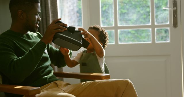 Father Sharing Virtual Reality With Curious Toddler - Download Free Stock Images Pikwizard.com