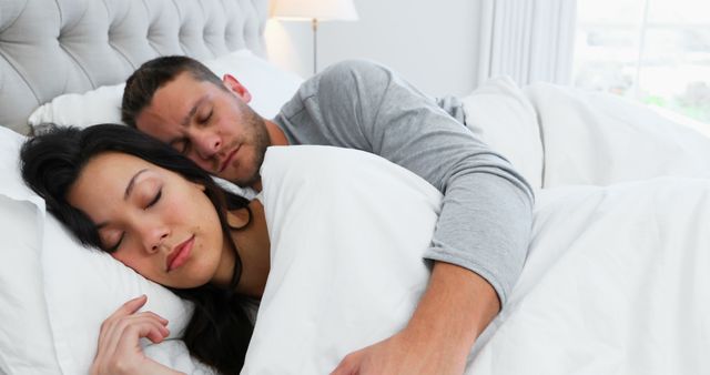 Caucasian couple sleeping in bed with copy space. Relationship, love, lifestyle, domestic life, concept, unaltered.