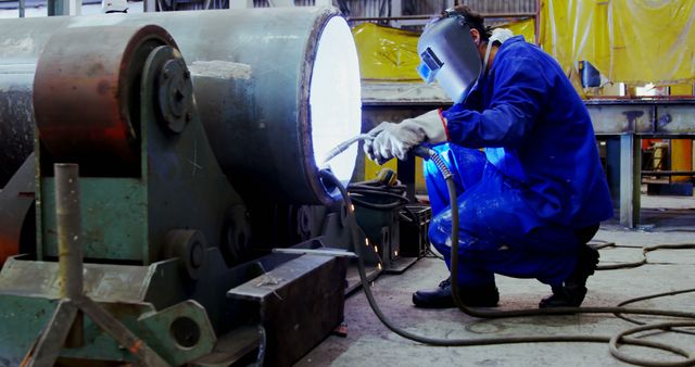 Industrial Worker Welding Large Metal Pipe in Factory - Download Free Stock Images Pikwizard.com