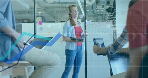 Business Team Analyzing Data Projections in Modern Office