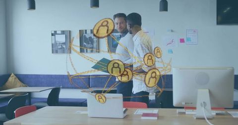 Coworkers Discussing Networking Technology in Office Lounge