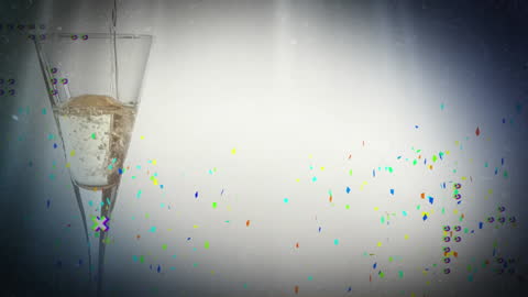 Champagne Bubbles Flow in Celebratory Glass