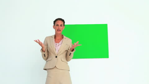 Confident Woman Presenting in Front of Blank Board