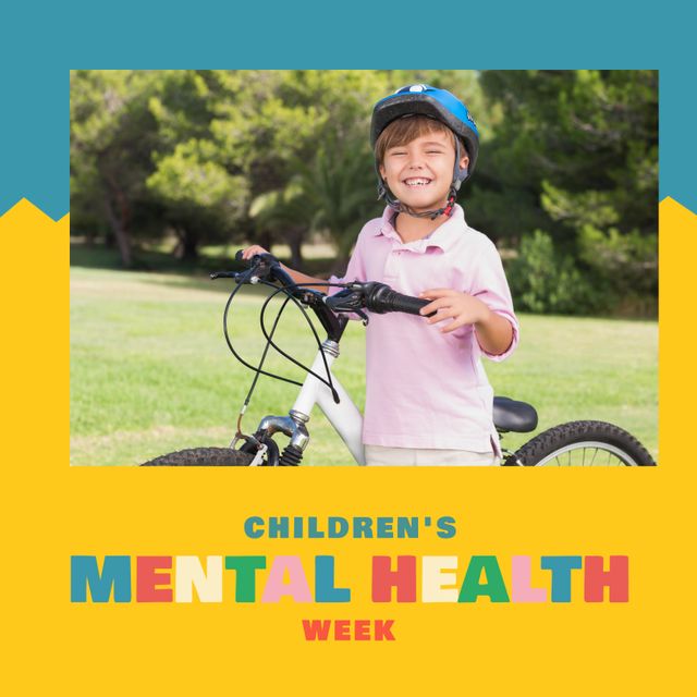Cute boy wearing bicycle helmet, smiling while holding bike in park. This can be used in campaigns and social media posts promoting children's mental health week, healthy lifestyle initiatives, and wellness programs aimed at young children.