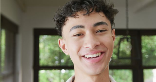 Smiling Young Man with Casual Attire Indoors - Download Free Stock Images Pikwizard.com