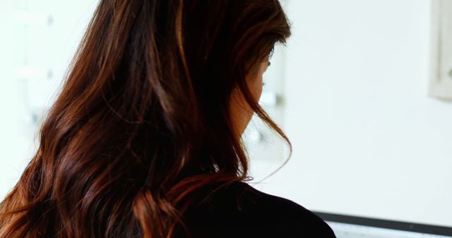 Woman with Long Alluring Hair Working on Computer - Download Free Stock Images Pikwizard.com