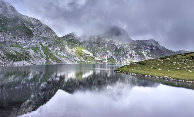 Serene Mountain Lake with Mist and Reflections - Download Free Stock Photos Pikwizard.com