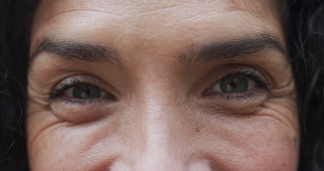 Close-up of Woman's Eyes with Subtle Smile, Expressive Look - Download Free Stock Images Pikwizard.com