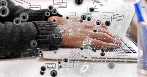 Typing on laptop with modern digital interface overlays