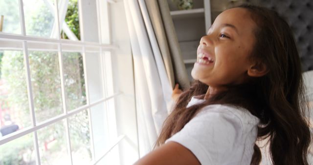 Happy Child Opening Curtains to Sunny Window - Download Free Stock Images Pikwizard.com