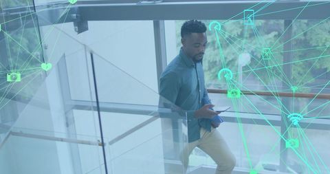 African American Businessman Using Smartphone with Media Icons